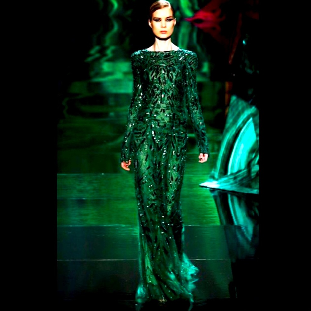 Monique Lhuillier emerald green long sleeve gown.